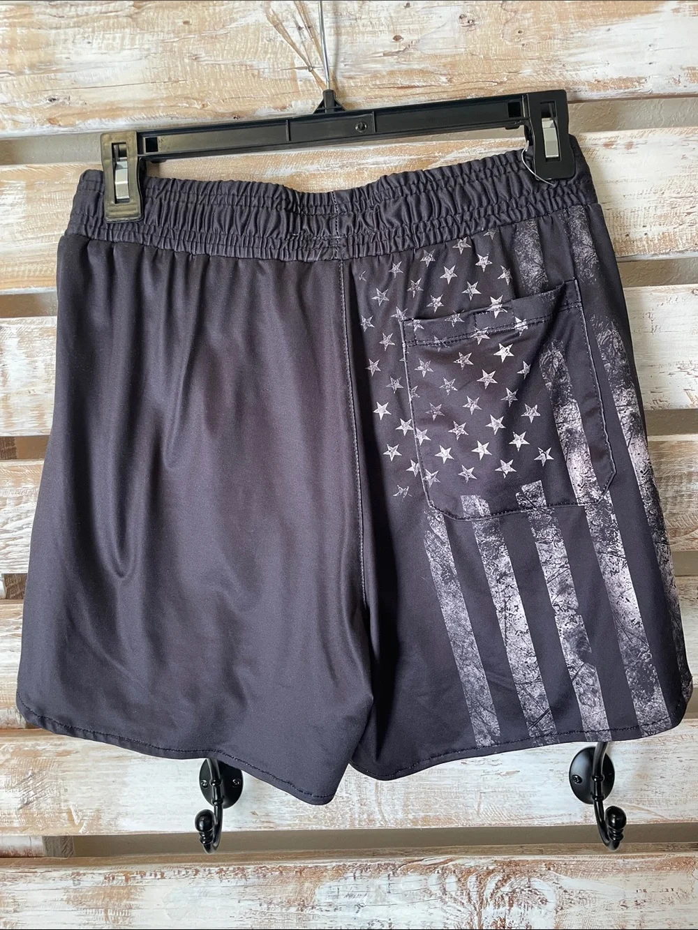 black tactical-style swim trunks by FT Fenteng | faded American flag has pockets